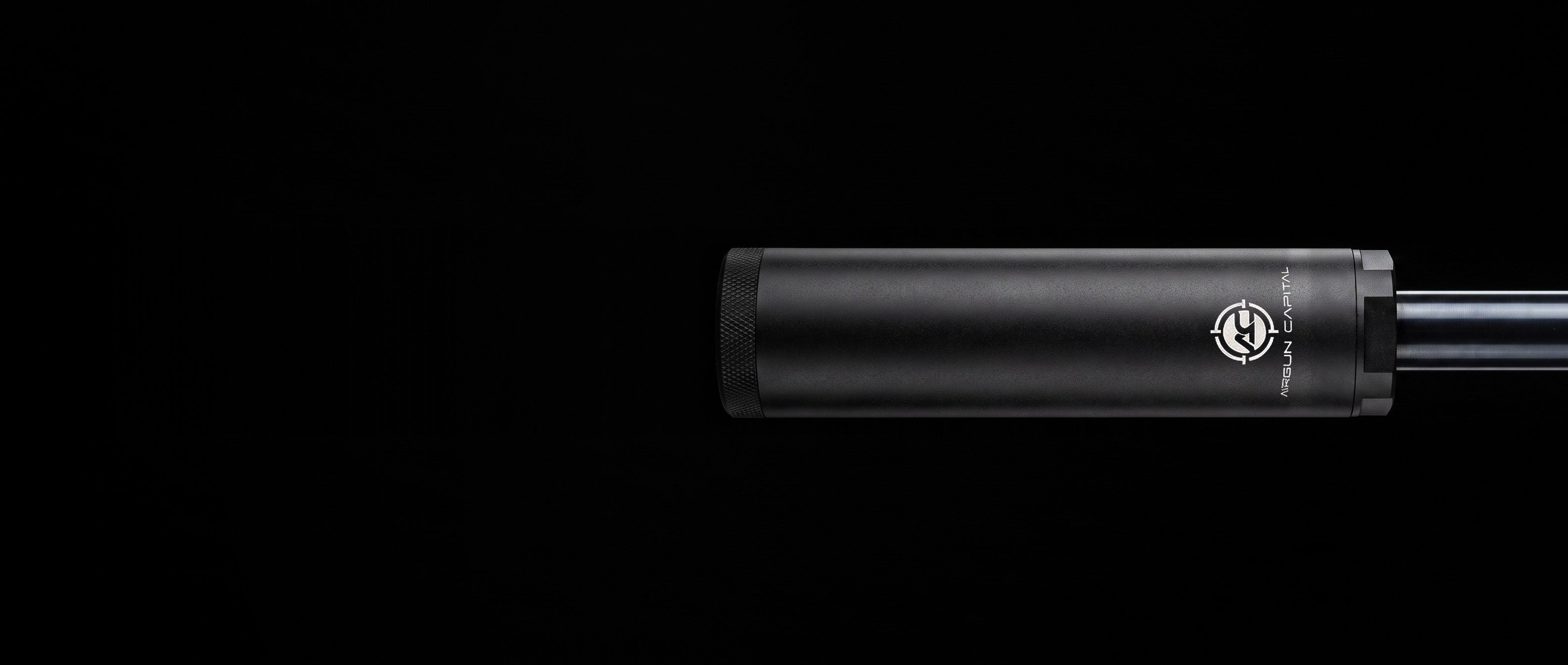 Falcon airgun suppressor on an air rifle barrel entering from the right, black studio
