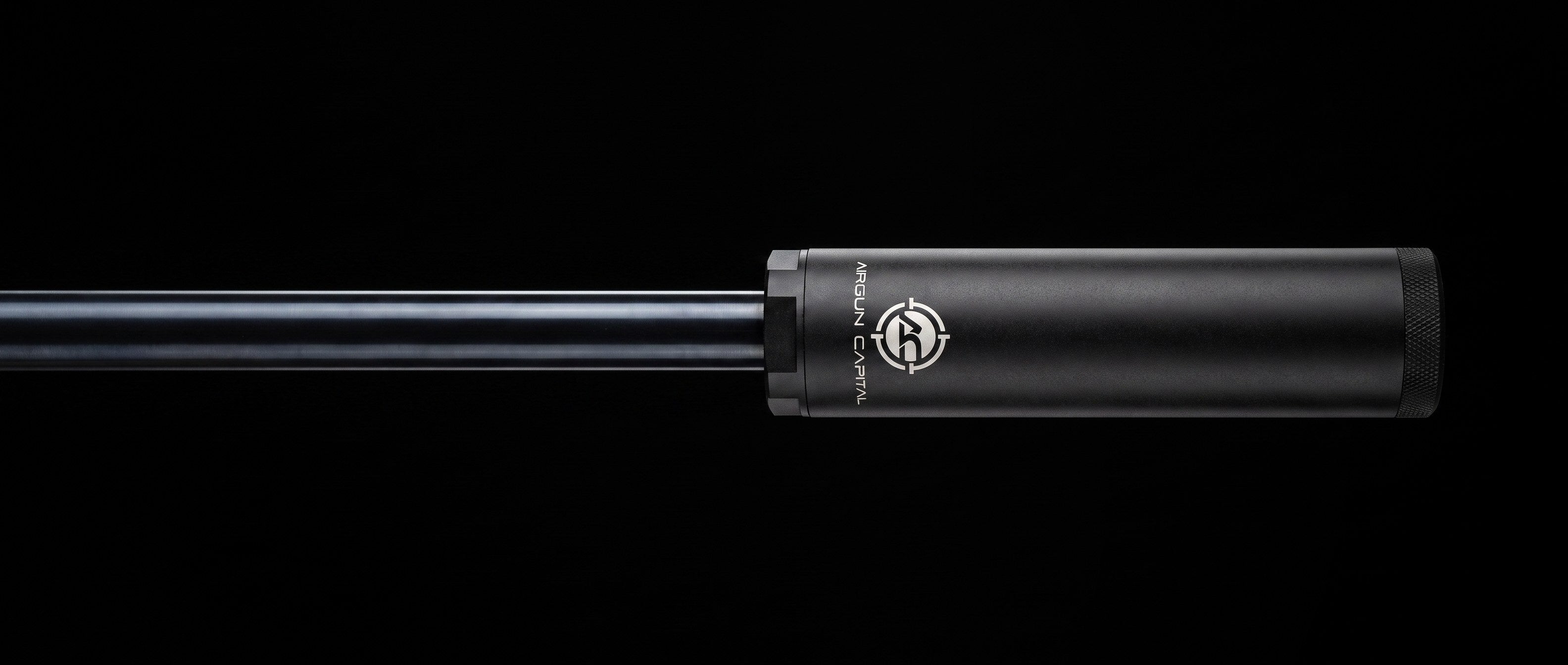 Falcon airgun suppressor mounted on an air rifle barrel, black studio